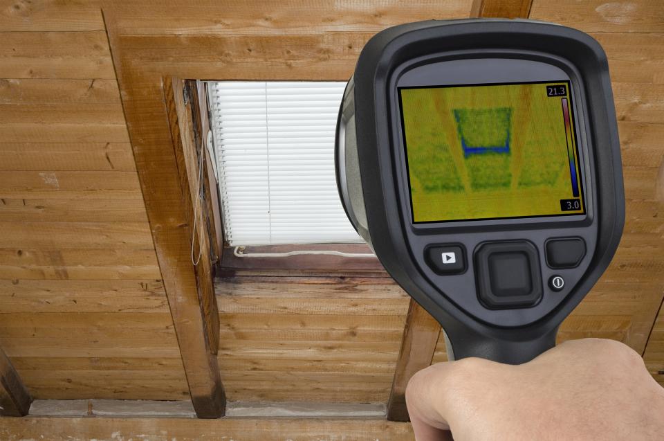 energy audit using thermal imaging camera pointed at window